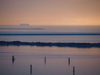 Scenic view of sea against sky at sunset