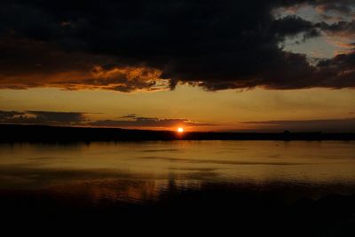 Scenic view of sea against sky at sunset