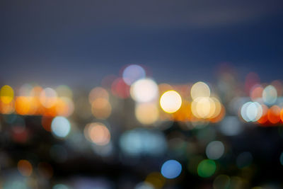 Defocused image of illuminated lights at night