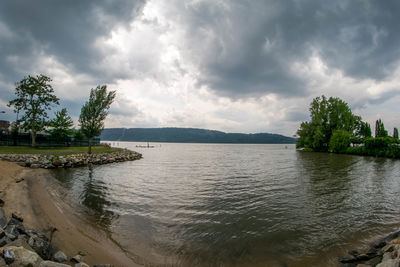 Scenic view of sea against cloudy sky