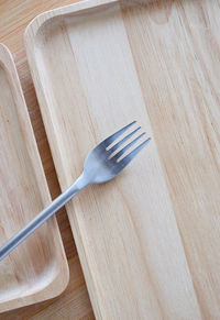 High angle view of fork on table