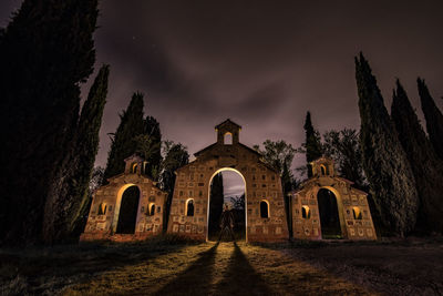 Old historic building against sky at night