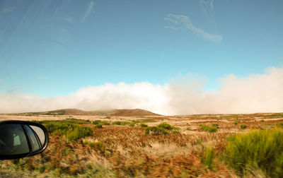 Scenic view of land road against sky