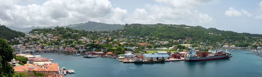 Panoramic view of townscape by sea against sky