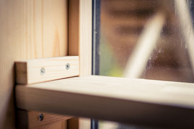 Close-up of glass window on table at home