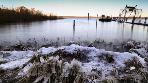 Scenic view of frozen lake against sky