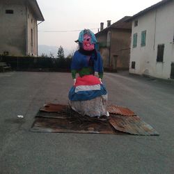 Full length of woman standing on railing