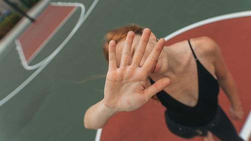 High angle view of woman standing in court