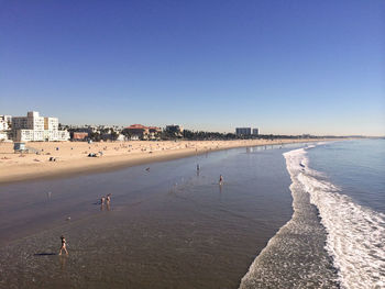 Panoramic view of beach against clear sky