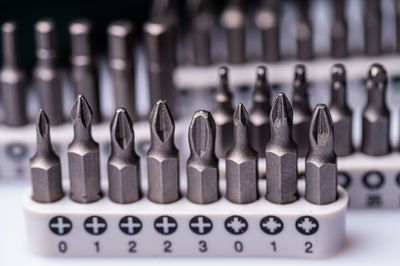 Interchangeable screwdriver bit set, isolated on white, selective focus, dof, close-up