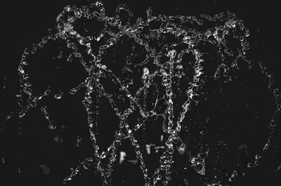 Close-up of splashing water against black background