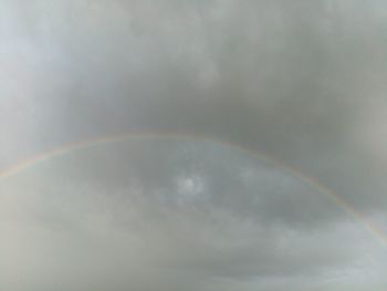 Low angle view of rainbow in sky