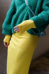 Midsection of woman standing outdoors