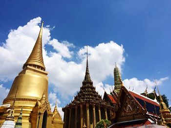 Low angle view of spires at wat phra kaew against sky