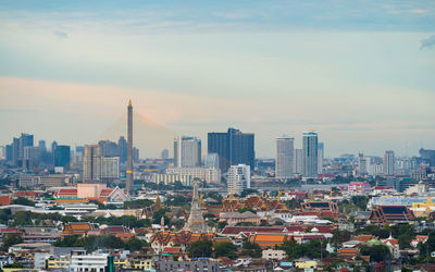 Modern buildings in city against sky