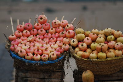 Pomegranates in basket for sale at market