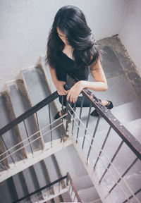 High angle view of woman on staircase