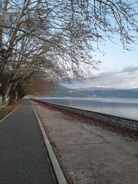 Road by sea against sky