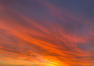 Low angle view of dramatic sky during sunset