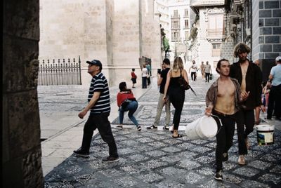 People walking on street in city