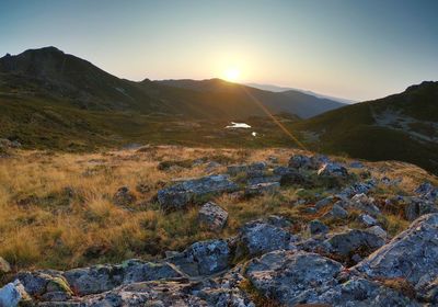 Scenic view of landscape against sky during sunset