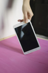 Low section of person using mobile phone