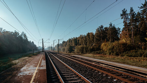 Railroad tracks against clear sky