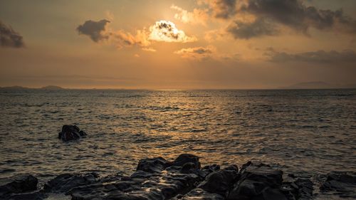 Scenic view of sea against sky during sunset