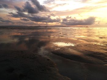 Scenic view of sea against cloudy sky