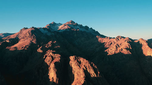 Scenic view of mountain range against clear sky