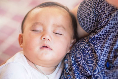 Close-up portrait of cute baby sleeping