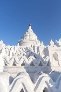 Low angle view of building against clear blue sky