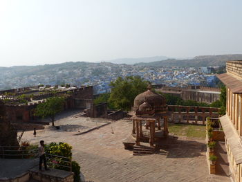 Buildings in city against clear sky