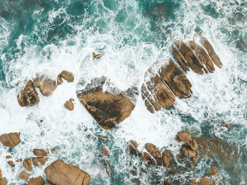 High angle view of waves on beach