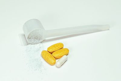 High angle view of bread in plate against white background