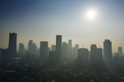 Modern buildings in city against clear sky