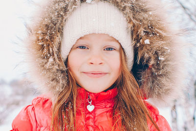 Portrait of young woman wearing warm clothing