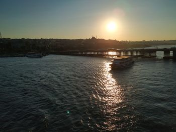 Scenic view of river against sky during sunset