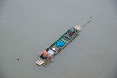 High angle view of people on boat in sea