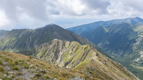 Grassy mountain ranges shrouded in low clouds, slovakia, europe