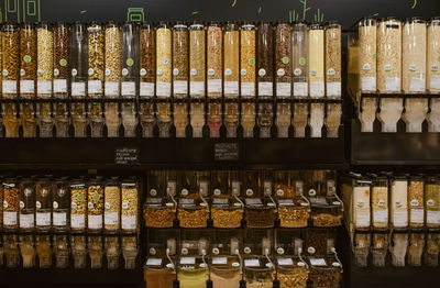 Full frame shot of food in glass bottles for sale at market