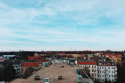 View of buildings against cloudy sky