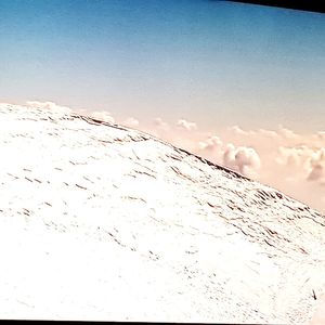 Scenic view of snow covered landscape against sky