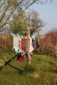 Close-up of socks hanging on clothesline