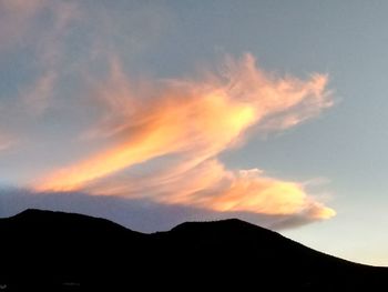 Scenic view of mountains against sky at sunset