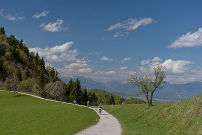 Empty road along countryside landscape