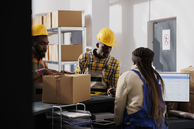 Rear view of man working in office