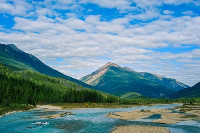 Scenic view of mountains against blue sky