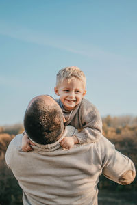 Father's day, happy loving family. father and son playing, having fun on the nature. happy family,