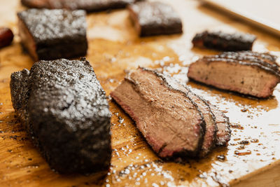 Slicing smoked brisket at a texas barbecue restaurant